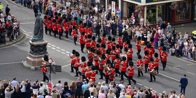 Military personnel arriving for the Guard Change at Windsor Castle, ahead of a minute's silence to mark the 20th anniversary of the attack on the United States, in Windsor, England, Saturday, Sept. 11, 2021. (Associated Press)