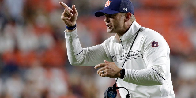 Auburn coach Bryan Harsin signals to players during the second half of an NCAA college football game against Akron on Saturday, Sept. 4, 2021, in Auburn, Ala.