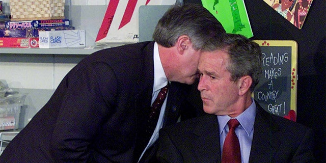 Chief of Staff Andy Card is photographed whispering in President George Bush's ear about the terrorist attacks on 9/11/01. AP photographer Doug Mills took this photo.
