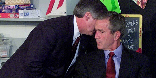 Chief of Staff Andy Card is photographed whispering in President George Bush's ear about the terrorist attacks on 9/11/01. AP photographer Doug Mills took this photo.