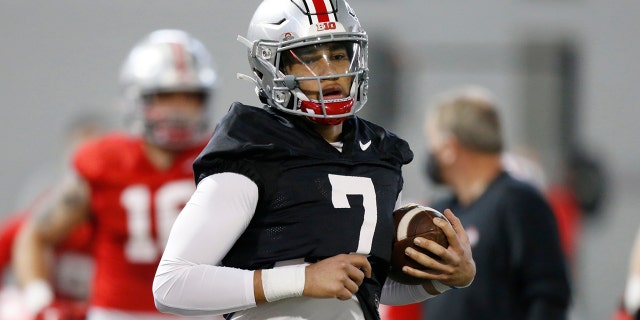 In this April 5, 2021 file photo, Ohio State quarterback CJ Stroud performs a workout during NCAA college football practice in Columbus, Ohio.
