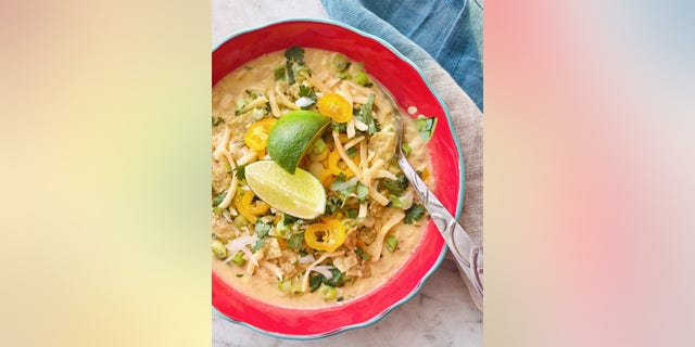 White corn chicken chili combines shredded chicken, cilantro and spices to create a classic southwestern flavored dish.