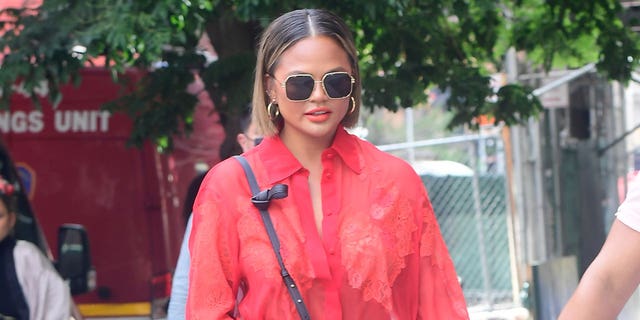 Chrissy Teigen is seen walking in SoHo on August 20, 2021 in New York City.  The model revealed that she had the fat removed from her cheeks by Dr Diamond.