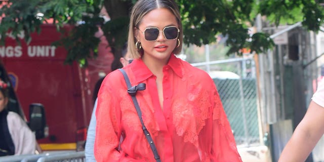 Chrissy Teigen is seen walking in SoHo on August 20, 2021 in New York City. The model revealed she had fat removed from her cheeks by Dr. Diamond.