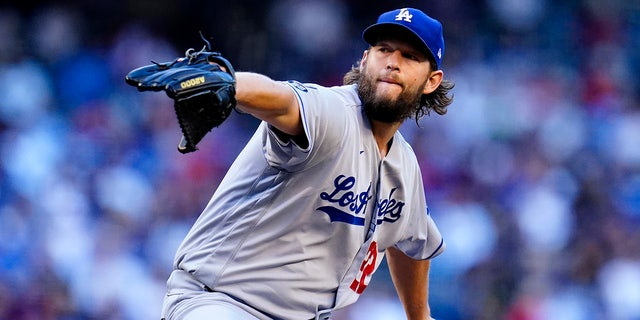 Los Angeles Dodgers starting pitcher Clayton Kershaw throws a pitch against the Arizona Diamondbacks during the first inning of a baseball game Saturday, Sept. 25, 2021, in Phoenix.