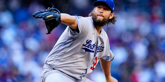 Los Angeles Dodgers starting pitcher Clayton Kershaw throws a pitch against the Arizona Diamondbacks during the first inning of a baseball game Saturday, Sept. 25, 2021, in Phoenix.