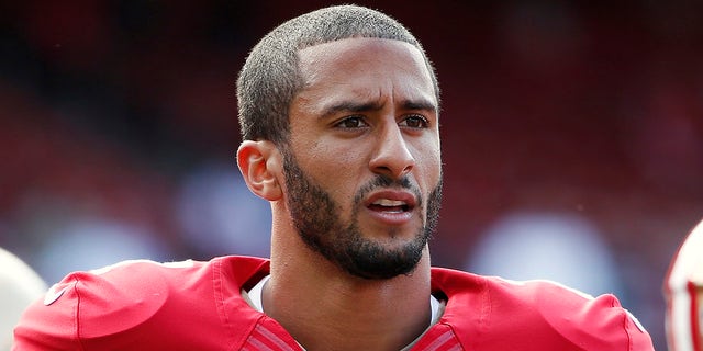 San Francisco 49ers quarterback Colin Kaepernick stands on the field before their NFL pre-season football game against the Denver Broncos in San Francisco, California, U.S. August 8, 2013.
