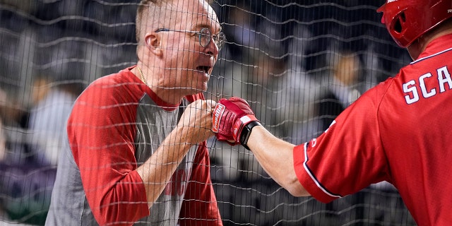 Former White House chief of staff Mick Mulvaney fist bumps House Minority Whip Steve Scalise during the first inning of the Congressional Baseball Game at Nationals Park, Sept. 29, 2021, in Washington.