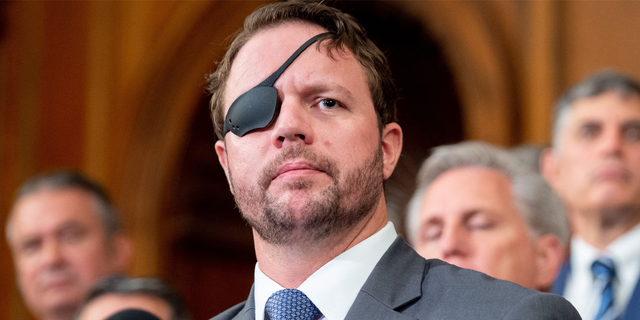 US Representative Dan Crenshaw (L), Republican of Texas, speaks alongside fellow Republicans about the US military withdrawal from Afghanistan, criticizing US President Joe Biden's actions, during a press conference at the US Capitol in Washington, DC August 31, 2021. 
