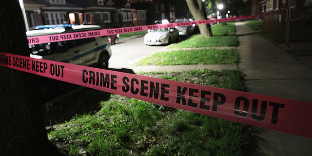 A police tape is drawn at a crime scene in Chicago. Democratic cities are one of the most violent cities in the country.