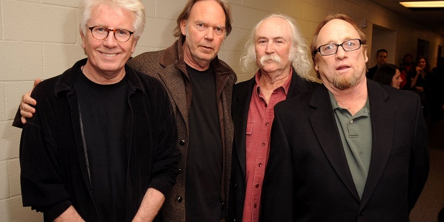 Musicians Graham Nash, Stephen Stills, David Crosby and Neil Young.  