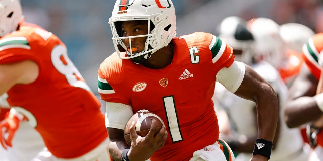 Miami quarterback D'Eriq King (1) runs with the ball during the first quarter of an NCAA college football game against Michigan State, Saturday, Sept. 18, 2021, in Miami Gardens, Fla.