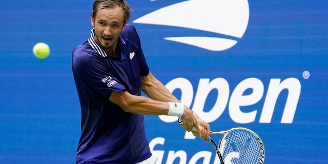 Daniil Medvedev, of Russia, returns a shot to Novak Djokovic, of Serbia, during the men's singles final of the US Open tennis championships, Sunday, Sept. 12, 2021, in New York. (AP Photo/John Minchillo)