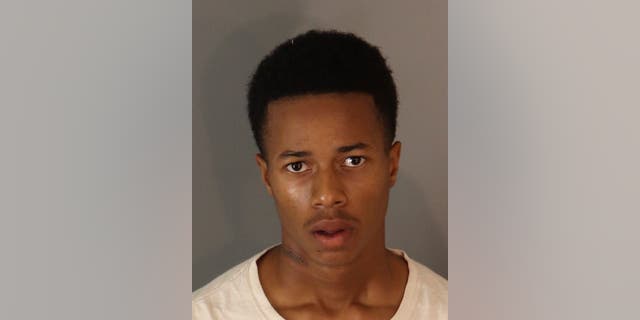A booking photo of Davione Green