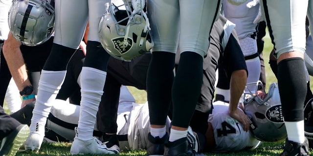 Las Vegas Raiders quarterback Derek Carr (4) is injured on a play during the second half of an NFL football game against the Pittsburgh Steelers in Pittsburgh, Sunday, Sept. 19, 2021. Carr remained in the game.