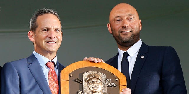 Derek Jeter poses with his plaque during the Baseball Hall of Fame induction ceremony on Sept. 8, 2021, in Cooperstown, New York. 