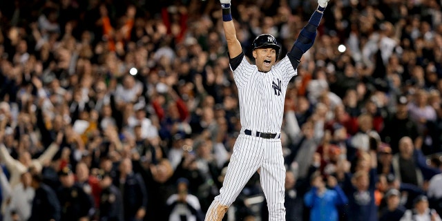 FILE - In this Sept. 25, 2014, file photo, New York Yankees' Derek Jeter jumps after hitting the game-winning single against the Baltimore Orioles in the ninth inning of a baseball game, in New York. The Yankees won 6-5. It was Jeter's last home game of his career at Yankee Stadium. The Baseball Hall of Fame will induct Jeter on Wednesday, Sept. 8, 2021. (AP Photo/Julie Jacobson, File)