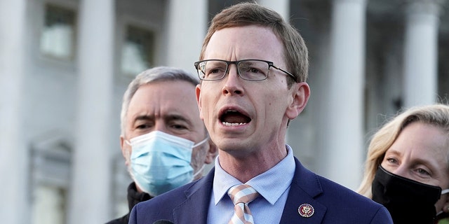 Dusty Johnson, R-S.D., with the Problem Solvers Caucus and other members, speaks at a news conference on the forthcoming passage of the bipartisan emergency COVID-19 relief bill in Washington, D.C., Dec. 21, 2020. (REUTERS/Ken Cedeno)