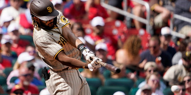 San Diego Padres' Fernando Tatis Jr. hits an RBI single during the third inning of a baseball game against the St. Louis Cardinals Sunday, Sept. 19, 2021, in St. Louis. (AP Photo/Jeff Roberson)