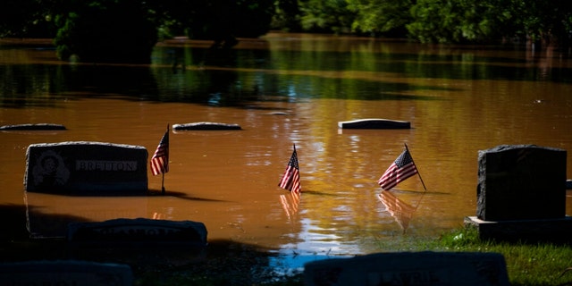 Headstones at a cemetery that flooded are seen in Somerville, N.J. Thursday, Sept. 2, 2021. 