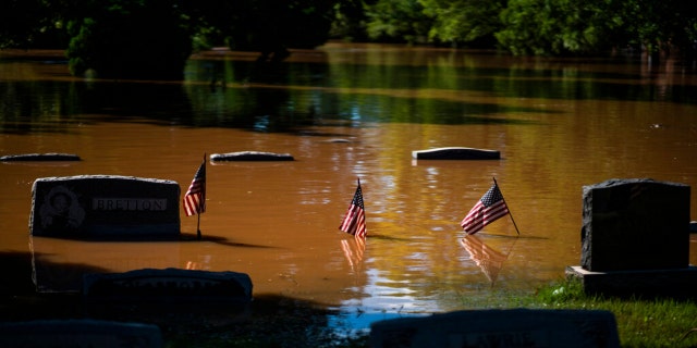 Headstones at a cemetery that flooded are seen in Somerville, N.J. Thursday, Sept. 2, 2021.