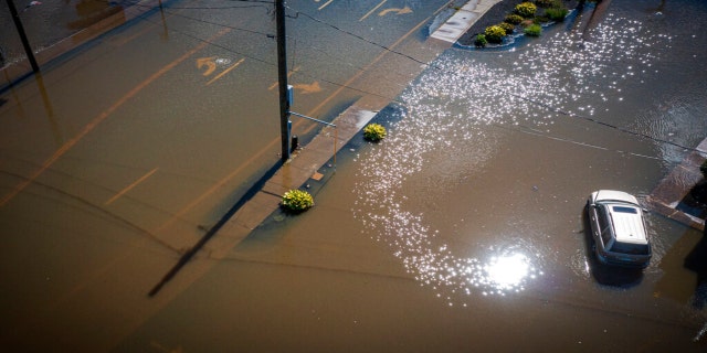 Rainfall from the remnants of Hurricane Ida submerge Mix Street near Farmington Avenue in Bristol, Conn., Thursday, Sept. 2, 2021.