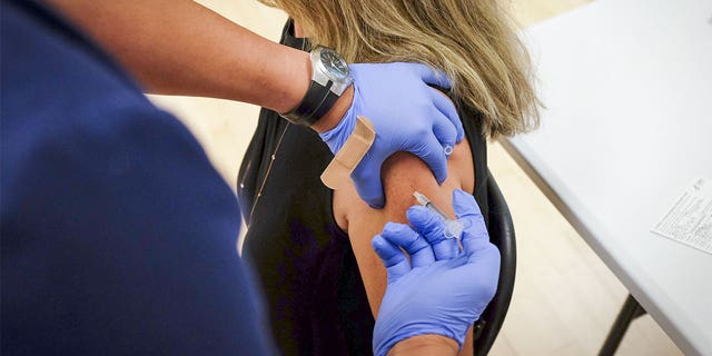 FLORIDA, USA - AUGUST 24: A woman receives the Pfizer-BioNTech COVID-19 Vaccine during a vaccination event, in Key Biscayne, Florida, United States on August 24, 2021. (Photo by Marco Bello/Anadolu Agency via Getty Images)