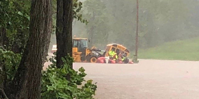 10 students and a driver were rescued off this flooded school bus in western Maryland. 