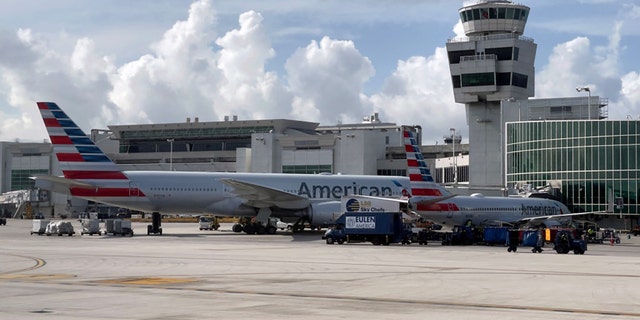 American Airlines planes are seen at the gates at Miami International Airport (MIA) on August 1, 2021 in Miami, Florida. (Photo by DANIEL SLIM/AFP via Getty Images)