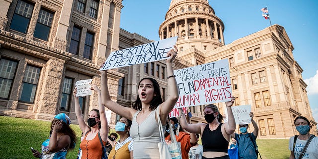 AUSTIN, TX - SEPT 1: Pro-choice protesters march outside the Texas State Capitol on Wednesday, Sept. 1, 2021 in Austin, TX. Texas passed SB8 which effectively bans nearly all abortions and it went into effect Sept. 1. A request to the Supreme Court to block the bill went unanswered and the Court still has yet to take any action on it. (Sergio Flores For The Washington Post via Getty Images)