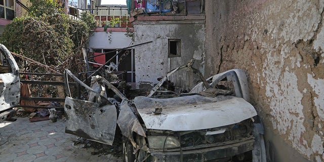 Photo taken on Sept. 2, 2021 shows a damaged vehicle at the site of the U.S. airstrike in Kabul, capital of Afghanistan. TO GO WITH: "Feature: Neighbor, relative of drone strike victims lambaste U.S. killing in Afghanistan.