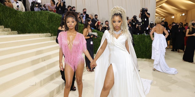 Sisters Chloe Bailey and Halle Bailey donned sultry pink and white looks at the 2021 Met Gala.