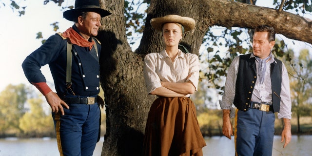 From left: John Wayne, Constance Towers and William Holden