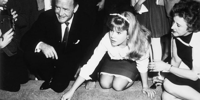 Hayley Mills at Grauman's Chinese Theatre with her parents, British actor John Mills and writer Mary Mills.