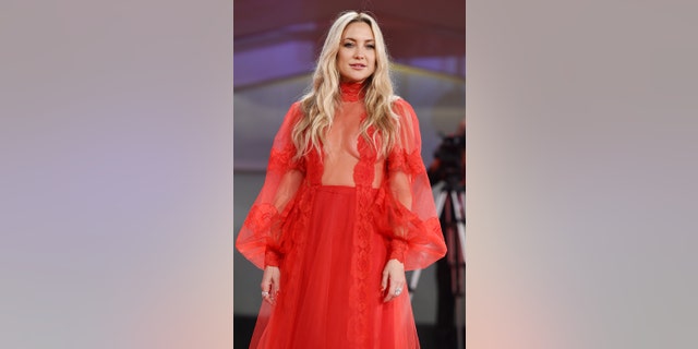 Kate Hudson's bold, floor-length red gown from the Valentino Resort 2022 collection. 