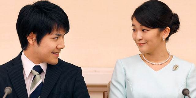 Princess Mako (R), the eldest daughter of Prince Akishino and Princess Kiko, and Kei Komuro (L), smile during a press conference to announce their engagement at the Akasaka East Residence in Tokyo on Sept. 3, 2017.
