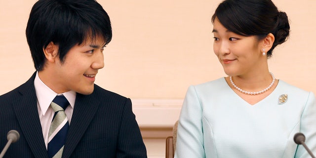 Princess Mako (R), the eldest daughter of Prince Akishino and Princess Kiko, and Kei Komuro (L), smile during a press conference to announce their engagement at the Akasaka East Residence in Tokyo on Sept. 3, 2017.