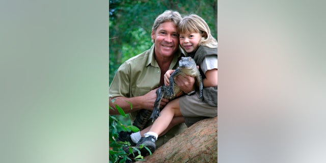 Steve Irwin with his daughter, Bindi Irwin, and a 3-year-old alligator called 'Russ' at Australia Zoo.