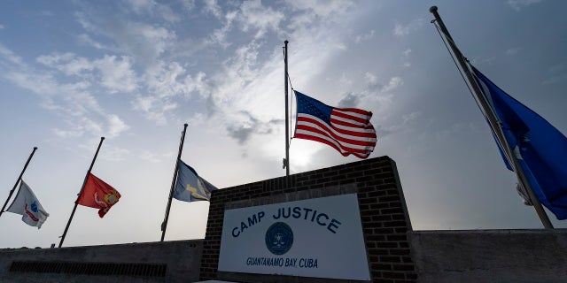 Flags fly at half-staff at Camp Justice at Guantanamo Bay Naval Base, Cuba, in honor of the U.S. service members and other victims killed in the terrorist attack in Kabul, Afghanistan,