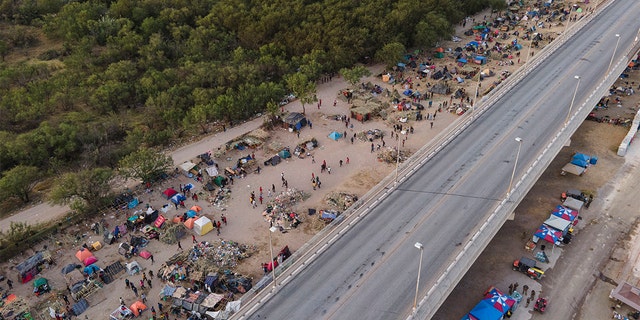 Migrants, many from Haiti, are seen at an encampment along the Del Rio International Bridge, Wednesday, Sept. 22, 2021, in Del Rio, Texas. (Associated Press)