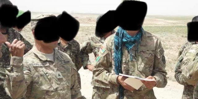 Zekria, with the blue scarf, alongside U.S. military in Afghanistan. 