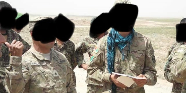 Zekria, with the blue scarf, alongside U.S. military in Afghanistan. 