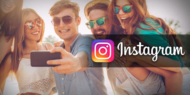 A group of people pose for an Instagram Selfie.