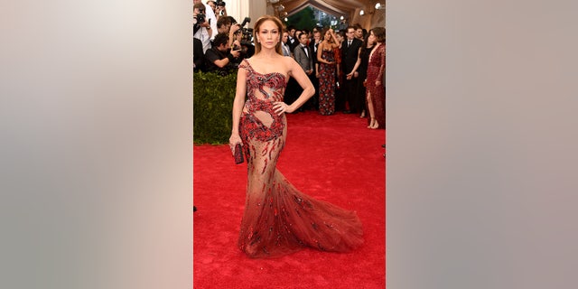 Jennifer Lopez rocked a sheer red dress featuring a dragon at the 2015 Met Gala.