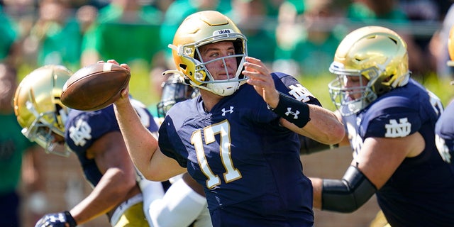Notre Dame quarterback Jack Coan (17) throws against Purdue during the first half of an NCAA college football game in South Bend, Indiana, Saturday, Sept. 18, 2021.