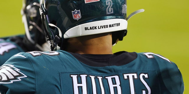 In this Jan. 3, 2021 photo, Philadelphia Eagles Jalen Hurts wears a Black Lives Matter decal on the back of his helmet during the team's NFL football game against the Washington Football Team in Philadelphia. (AP Photo/Rich Schultz, File)