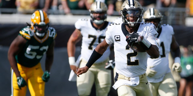 New Orleans Saints quarterback Jameis Winston (2) scrambles for yardage as Green Bay Packers linebacker Jonathan Garvin (53) gives chase during the first half of an NFL football game, Sunday, Sept. 12, 2021, in Jacksonville, Fla. (AP Photo/Stephen B. Morton)