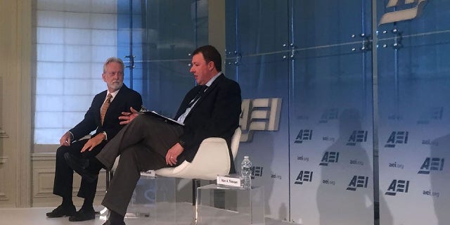 US psychologist James Mitchell (L) speaks with an interviewer at the American Enterprise Institute in Washington,DC on December 6, 2106. (Photo credit should read THOMAS WATKINS/AFP via Getty Images)