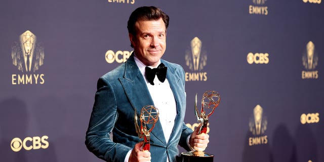 Jason Sudeikis poses with his Emmy awards on the red carpet during the 73rd Annual Emmy Awards taking place at LA Live on Sunday, Sept. 19, 2021 in Los Angeles, CA.