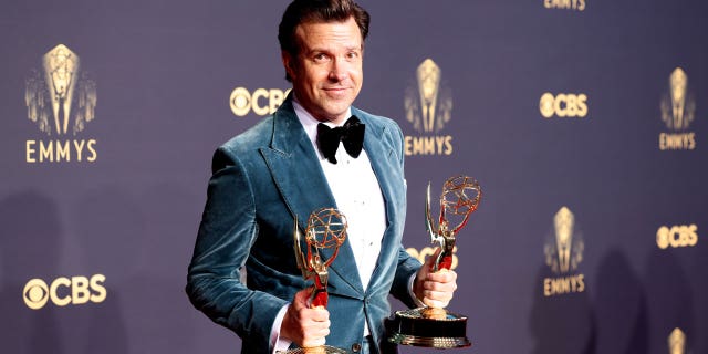 Jason Sudeikis poses with his Emmy awards on the red carpet during the 73rd Annual Emmy Awards taking place at LA Live on Sunday, Sept. 19, 2021 in Los Angeles, CA.